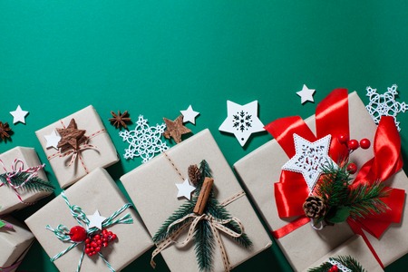 Christmas craft boxes decorated in vintage and natural style, top view with copy space
