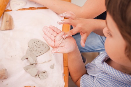 Happy children are engaged with modeling clay
