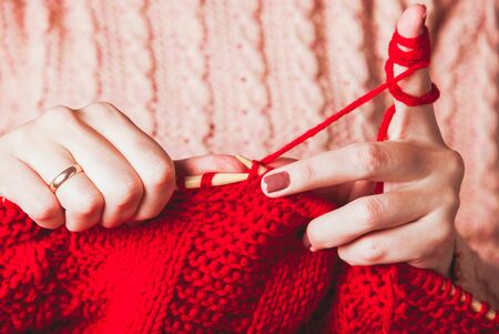 Female hands knits sweaterの写真素材