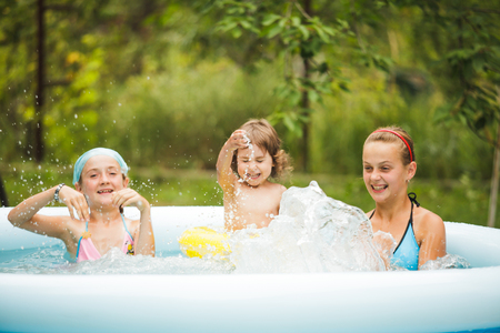 Girls in swimming poolの写真素材