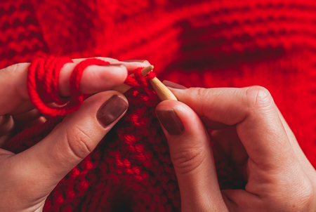 Female hands knits sweaterの写真素材