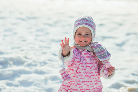 Girl enjoys the snowの写真素材