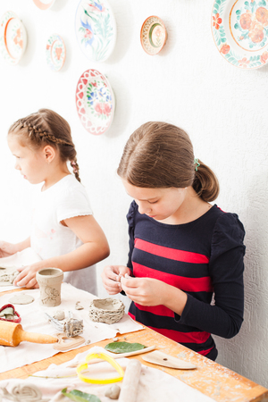 Child hands with plasticineの写真素材