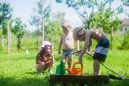 Kids gardening in the yardの写真素材