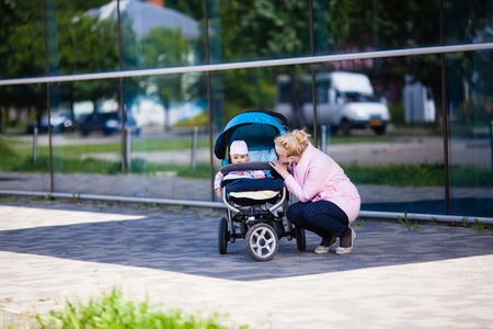 Fashionable mom with babyの写真素材