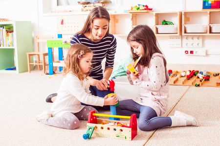 the teacner is showing how to do itの写真素材