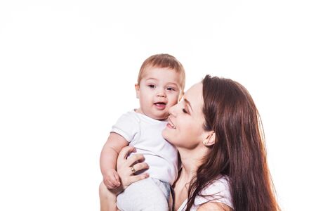 Mother hugs her baby isolatedの写真素材