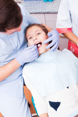 Teenager at the dental clinicの写真素材