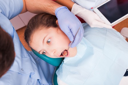 Teenager at the dental clinicの写真素材