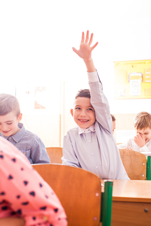 Active boy wants to give an answerの写真素材