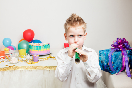 lovely boy is celebraiting birthday partyの写真素材