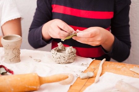 Child hands with plasticineの写真素材