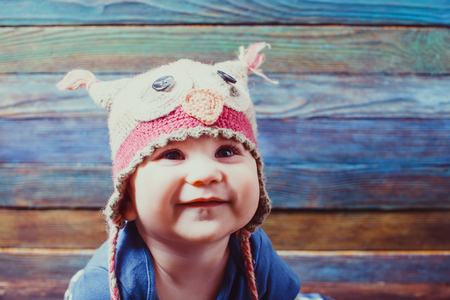 Little baby in a funny hatの写真素材