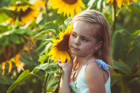 The girl listens to the sounds of the plantの写真素材