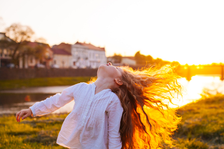 The girl enjoys her hairの写真素材