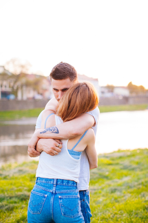 Sweet hugs of a loving coupleの写真素材