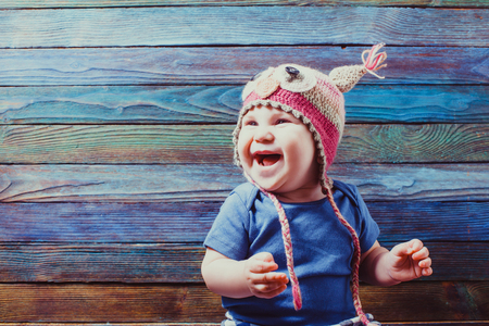 Smiling baby wearing funny hatの写真素材