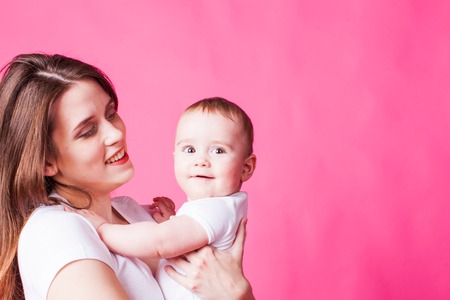 Charming mother smiling to her babyの写真素材