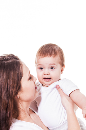 Mother looking at her amazed babyの写真素材