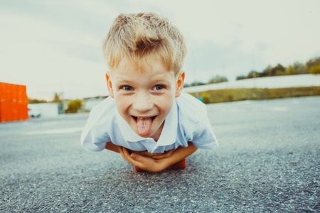 Boy on penny board close-up in the summer outdoorsの写真素材