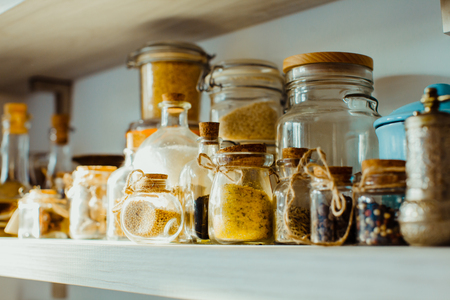 Modern kitchen shelves with various food ingredientsの写真素材