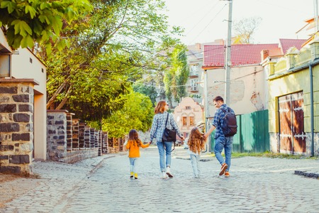 Family with two kids walking in the cityの写真素材