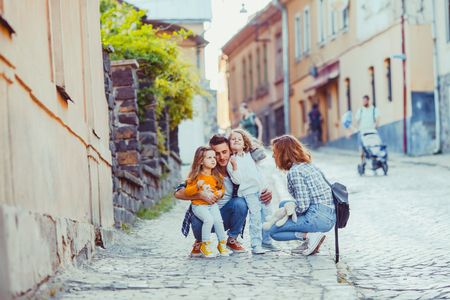 Father and mother traveling with their daughtersの写真素材