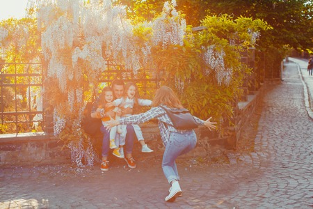 Happy family having fun in tourist city
