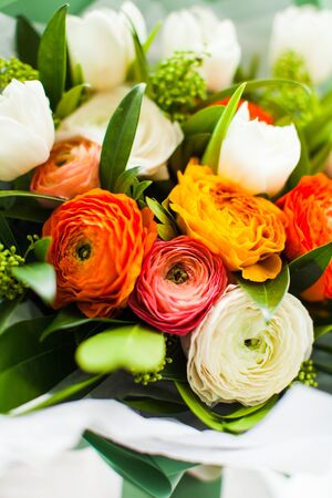 Bouquet of ranunculus and white tulips close upの写真素材