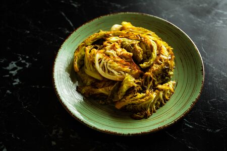 Grilled savoy cabbage on the plate close upの写真素材