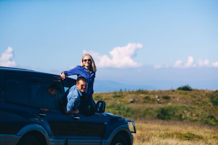 Man and woman arrived on an SUV high up in the mountain