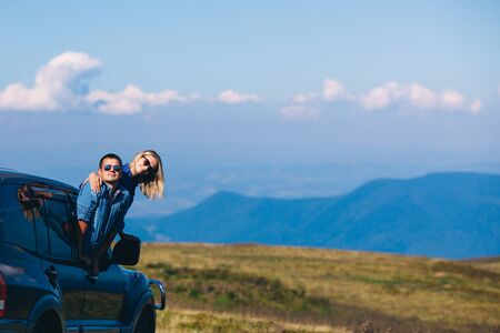 Couple arrived on an SUV high up in the mountain