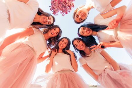 Group of bridesmaids making selfie at sky backgroundの写真素材