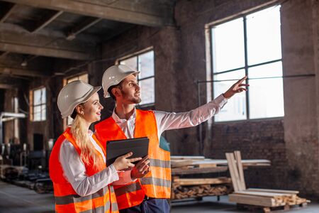 Two proffecinal architects working on new construction project on site work