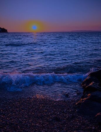 Sunset at the sea in the evening glowの写真素材