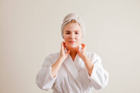 Morning exersises facial gimnastic. Woman practicing facial self- massageの写真素材