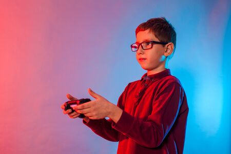 Boy using a gaming gadget for virtual reality in playing game zone