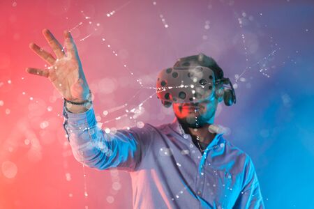 Man connection with abstract web and chains in virtual realityの写真素材