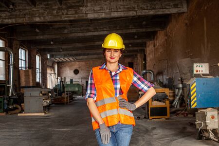 Young woman worker of furniture plant, indoors