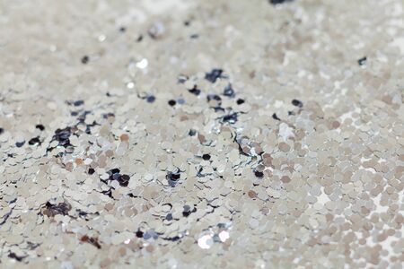 Silver explosion of confetti. Christmas festive background.