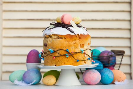 Professionaly baked traditional Easter bread - paska with stylish decoration on top. Multicilor eggs...