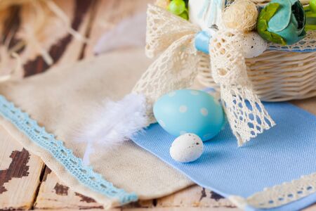Macro ceramic Easter egg on blue napkin