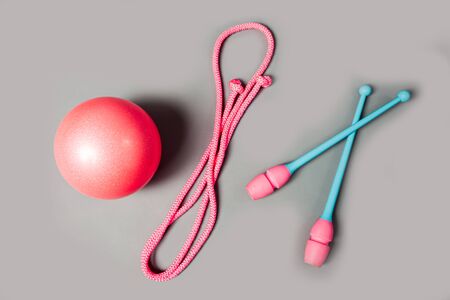 Colorful mace, rope and ball for gymnastics. Professional equipment for gymnastics workout.の写真素材