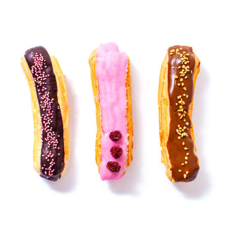 Delicious eclairs with chocolate, raspberry and caramel filling