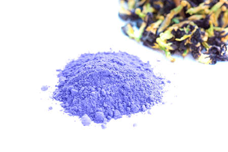 Blue matcha tea powder and blue butterfly pea flowers isolated on the white backgroundの写真素材