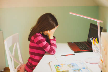 The upset schoolgirl who finds it difficult to study online