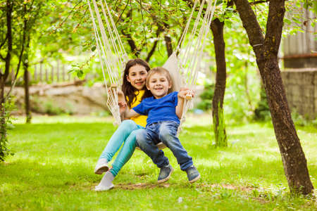 The beautiful little couple has a meeting in a local parkの写真素材