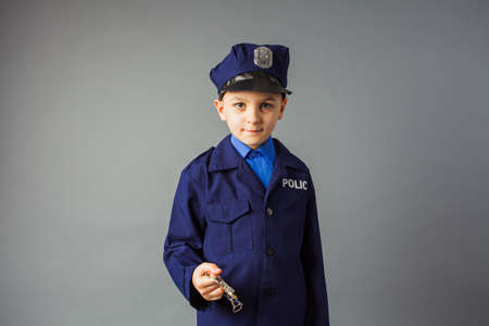 The little boy likes the profession of a policeman