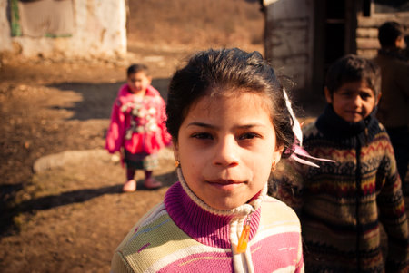 SEREDNIE, UKRAINE - MARCH 09, 2011: Romani girl looking straight inside your soulのeditorial素材