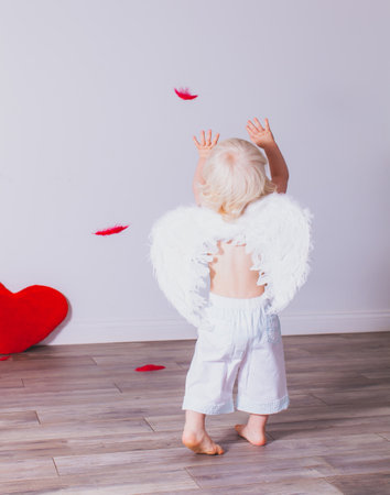 the cheerful toddler boy is having fun on Valentines dayの写真素材